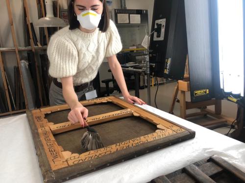 Is there anyone in there? Removing debris from in between the stretcher and canvas is always an adventure!